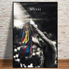 A black and white photo of Lionel Messi celebrating with a football, captured in a dramatic lighting style.