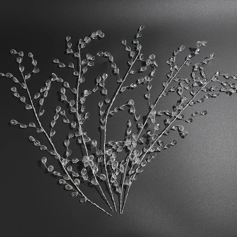 A delicate spray of clear crystal acrylic pendant ornaments used for holiday or event decoration.