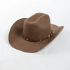 A brown wool cowboy hat with a studded leather band is shown against a white background.
