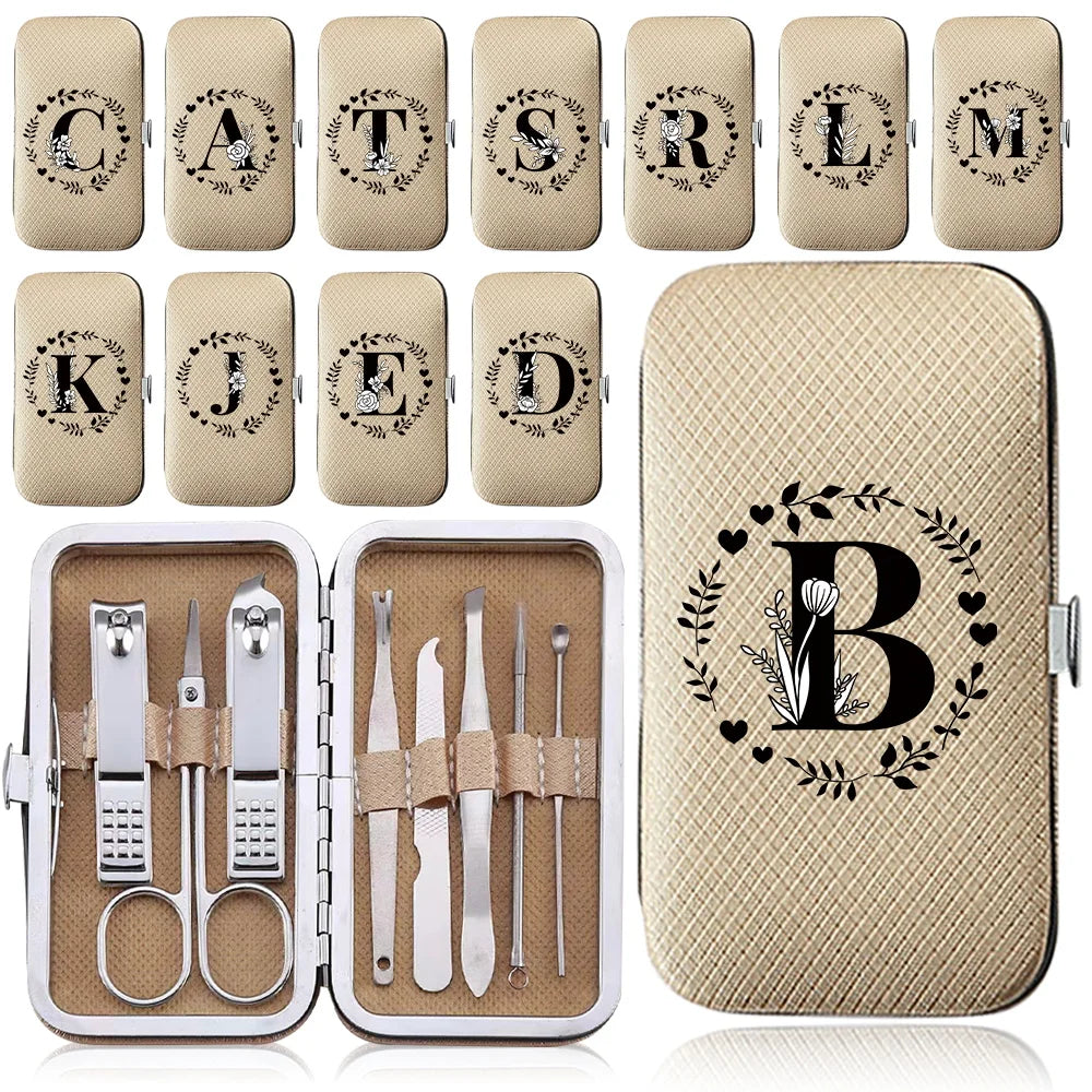 A set of eight metal manicure and pedicure tools is displayed alongside a beige leather case.