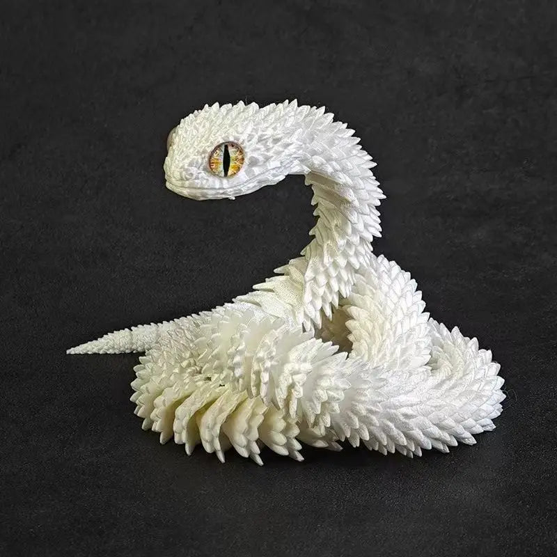 A white, textured 3D printed snake art model with an eye, coiled in a serpentine shape.