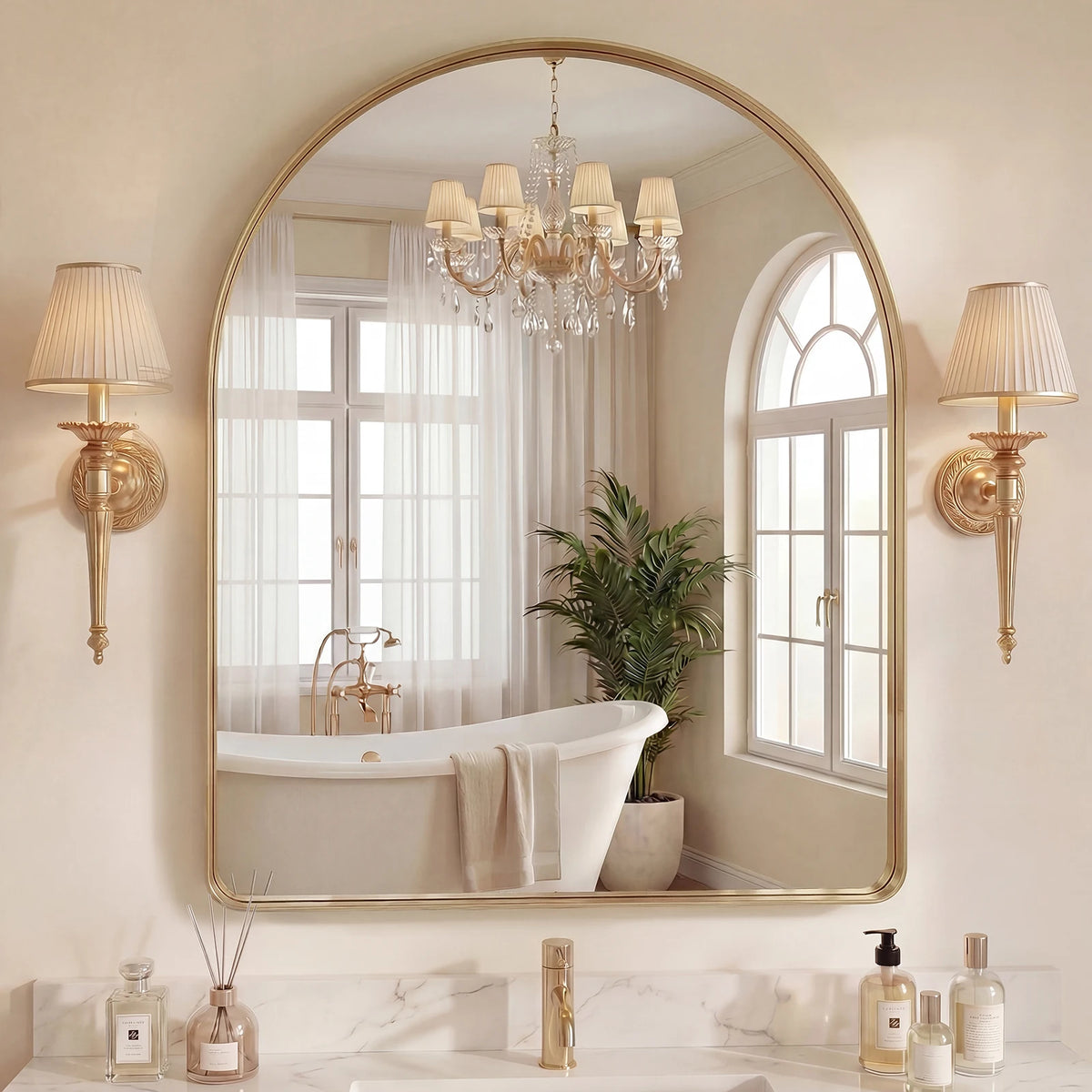 An arched full-length wall mirror with a matte black frame reflecting a chandelier and interior decor.