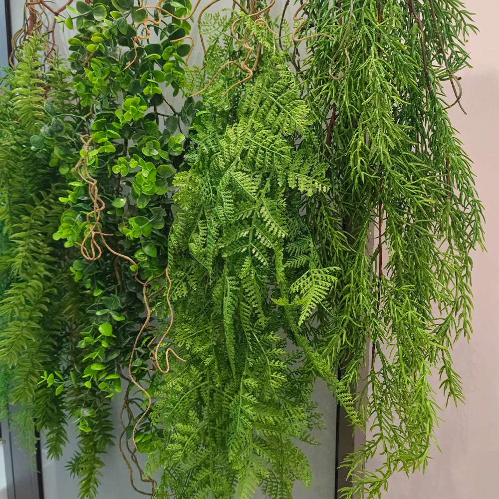 Artificial hanging ivy vine with green leaves and brown stems used for home and event decor
