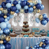 A blue and gold balloon arch decoration featuring balloons, confetti, and various treats for a party.