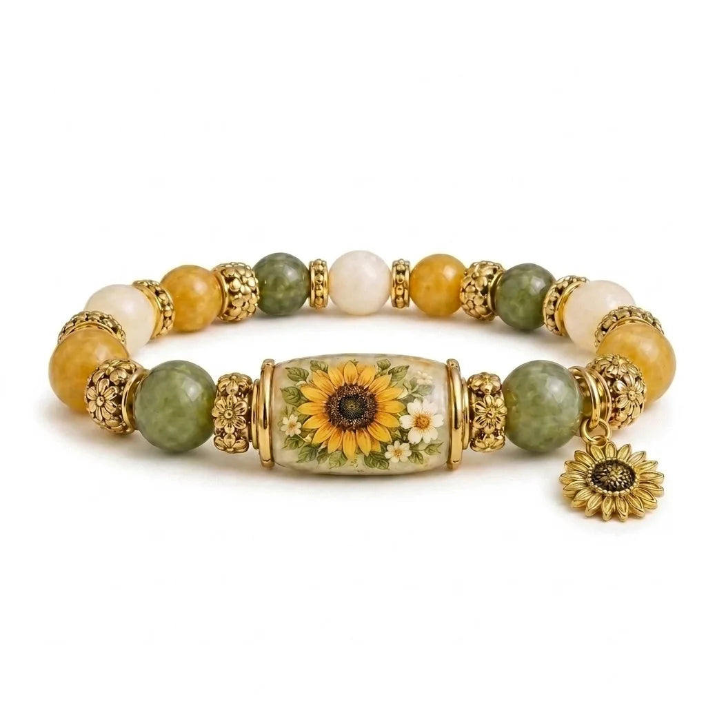 A stretch charm bracelet featuring round beads of yellow, white, and green stones with a central flower charm.
