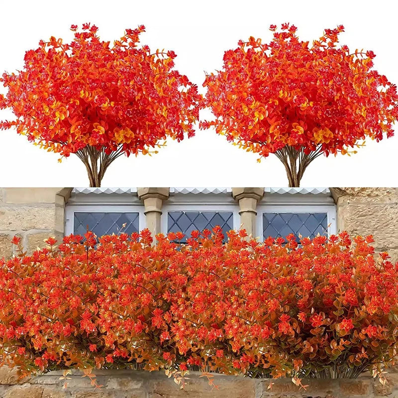 Bouquet de fleurs d'automne artificielles et d'Halloween avec du feuillage rouge et orange éclatant.