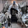 A set of spooky Halloween ghost and skeleton hanging decor featuring black and white figures on a dark doorway.