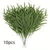 A bundle of 10 artificial green pine branches used for holiday decoration.