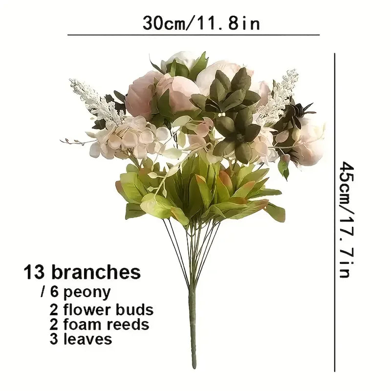 A bouquet of pink and white peony-like artificial flowers with green leaves and baby's breath on a thin stem.