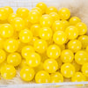 A pile of bright yellow, spherical love star balls for kids' play areas.
