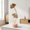 A delicate gold-toned iron ginkgo leaf ornament set displayed on a white surface.