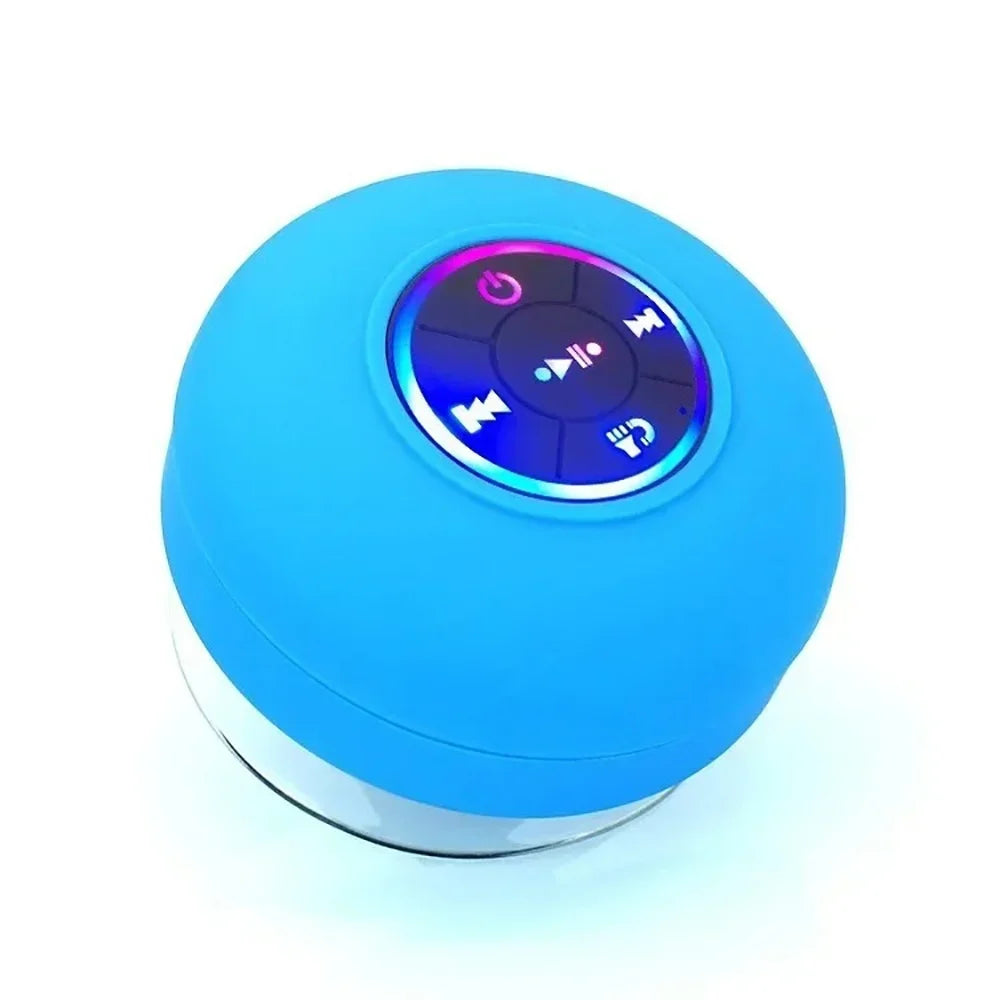 A bright blue waterproof Bluetooth speaker with a suction cup base and control buttons.