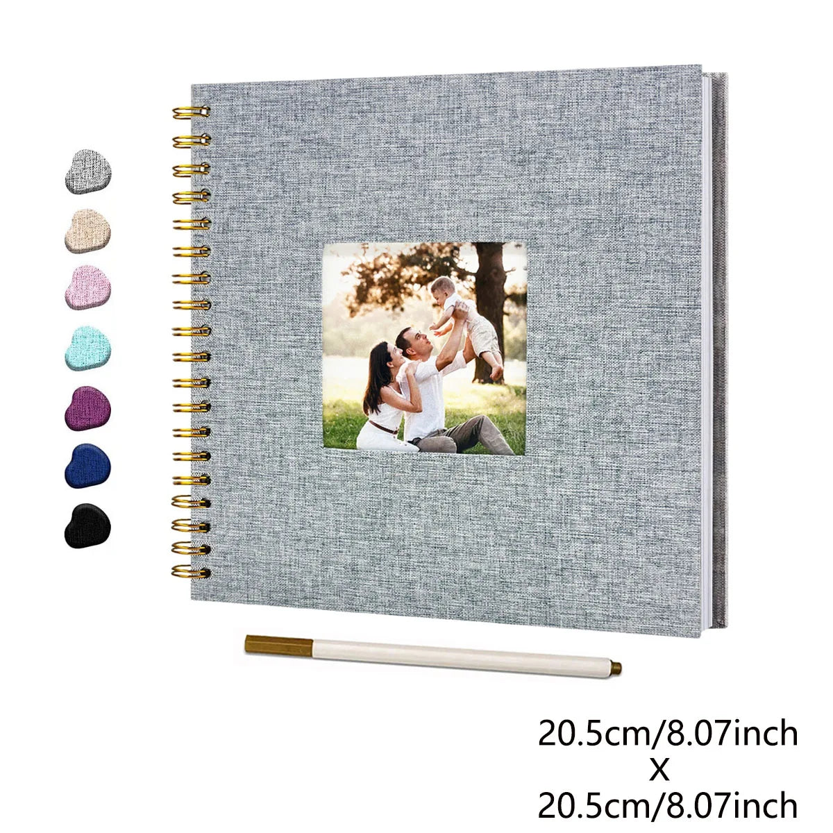 A grey linen cover scrapbook album with a gold spiral binding and a photo of a couple.