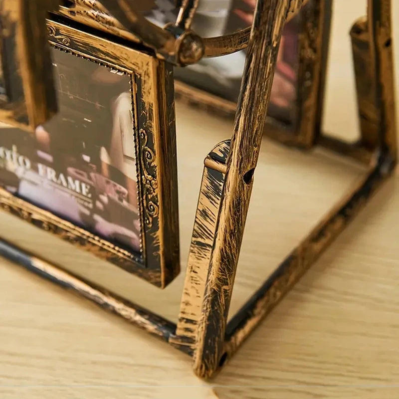 A close-up of a vintage resin rotating photo frame with a wooden frame displaying a picture.