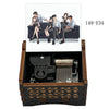 A wooden music box featuring an anime scene of characters from Detective Conan