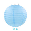 A light blue, round paper lantern with a gathered top, used for parties and weddings.