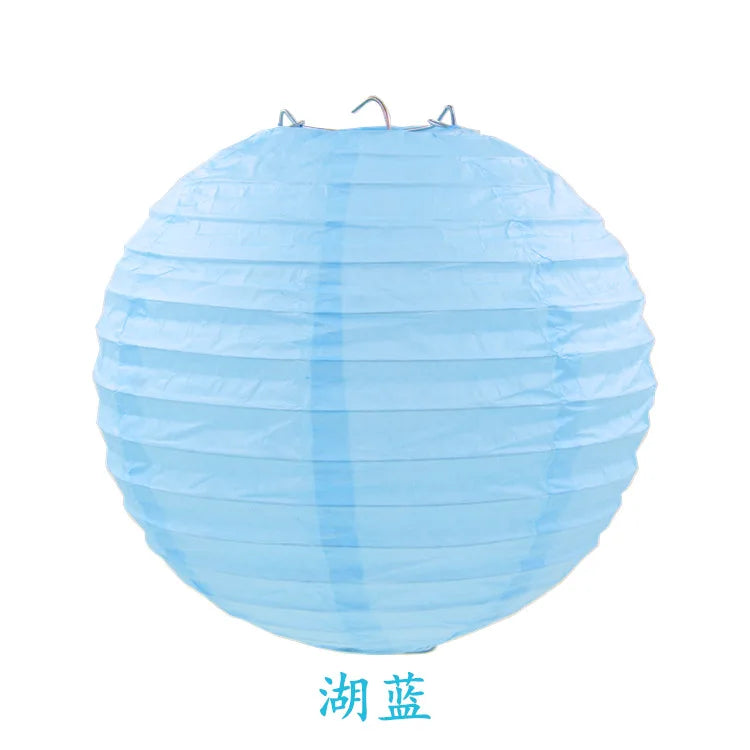 A light blue, round paper lantern with a gathered top, used for parties and weddings.