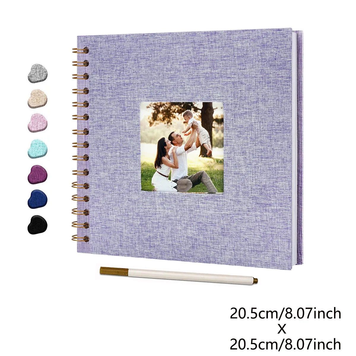 A purple linen cover scrapbook album with a gold-colored plastic sheet and several small photo stickers.