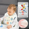 A baby is wearing a white bib with a food catcher pocket, next to a package of 100 disposable baby bibs.