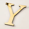 A shiny gold acrylic letter Y wall sticker for decorative purposes.