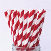 A bundle of red and white striped paper drinking straws in a glass container.