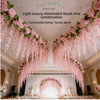 A ceiling decorated with a lush pink floral vine garland featuring hanging wisteria flowers and greenery.