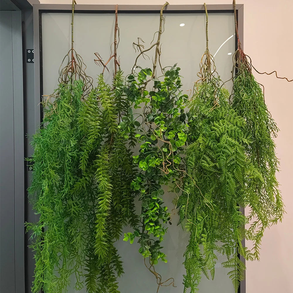 Artificial hanging ivy vine with green foliage displayed against a light background.
