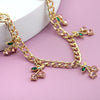 Gold chain necklace featuring pink and green glass stone cherry charms