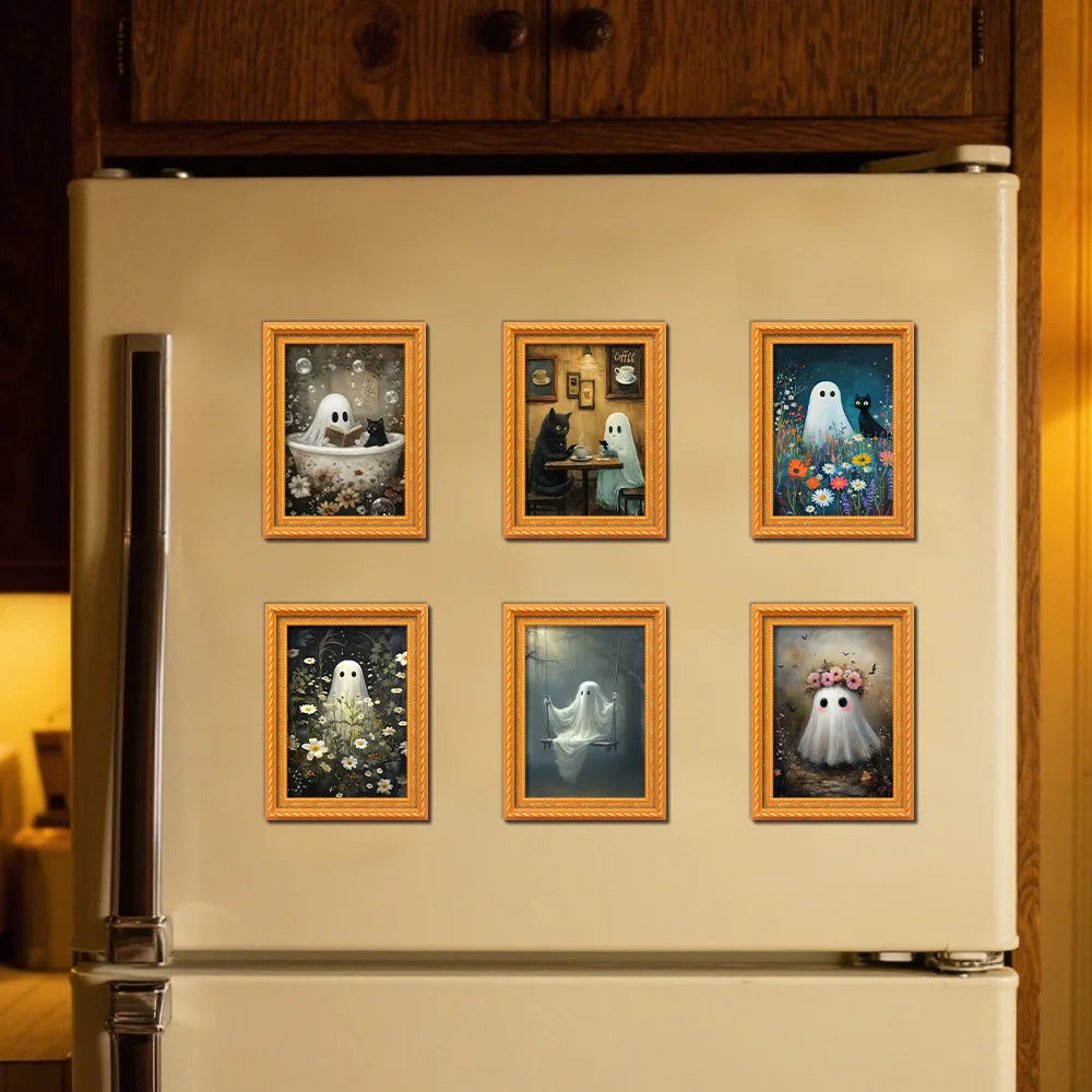 A white refrigerator features several framed magnets depicting cute ghost Halloween figures in retro photo frames.