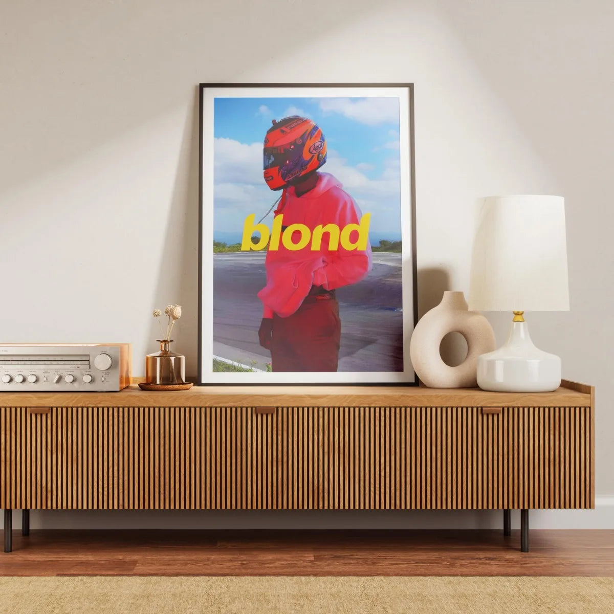 A canvas print featuring a portrait of a person wearing a red helmet and bright pink clothing against a blue sky background.