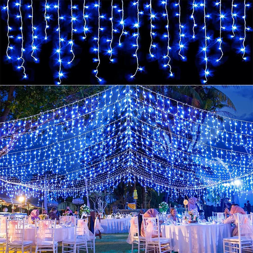 Blue waterfall curtain string lights draped across an outdoor event or venue.