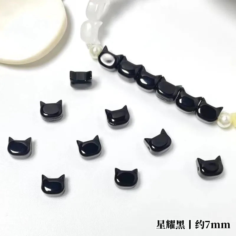 A string of black cat head glass beads for jewelry making, 7mm size.