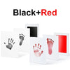 Black and red handprint and footprint ink pad kit showing various prints on white paper.
