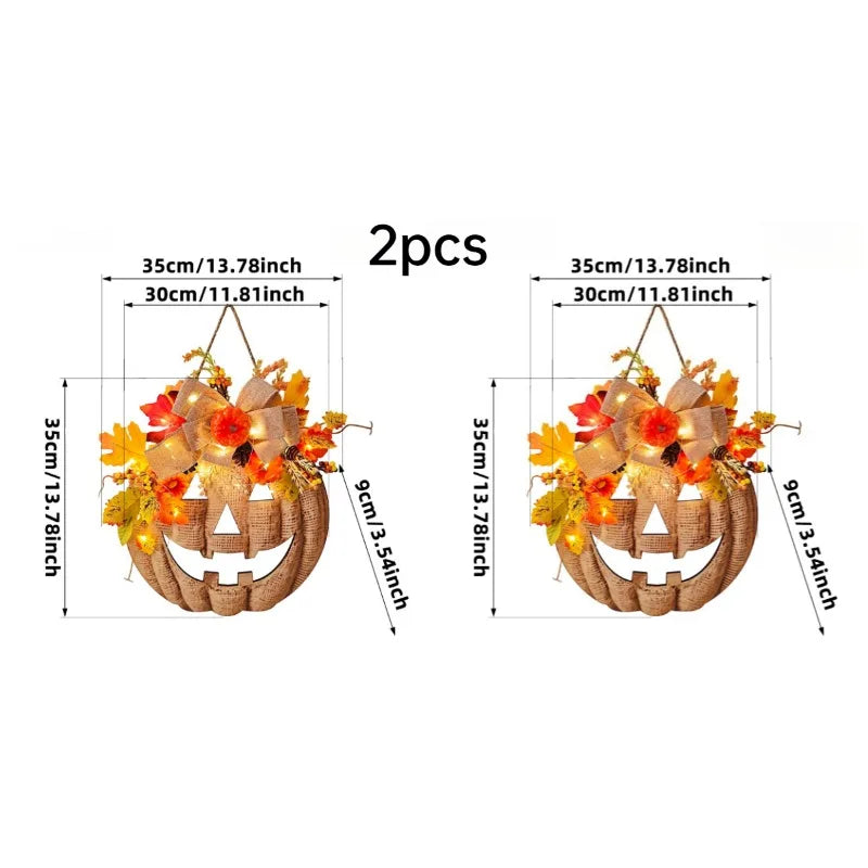 A set of two decorative plastic pumpkin door hangers with autumn leaves and lights.
