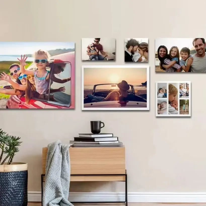 A gallery wall featuring several framed photos of a family and couple.