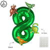 Green foil balloon banner shaped like the number 8 with dinosaur decorations for a birthday party