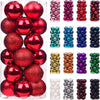 A collection of 24 festive Christmas tree ornament balls in various colors including red, pink, gold, and blue.