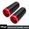 A pair of black and red universal silicone handlebar grip covers shown diagonally.