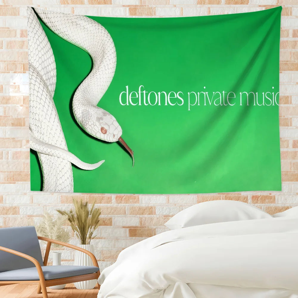 A green fabric flag featuring a white snake design and the text deftones private music.