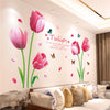 Pink tulip wall stickers featuring a flower and leaves on a white wall.
