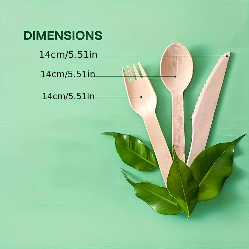 A set of light pink wooden cutlery including a fork, spoon, and knife displayed on a green surface.