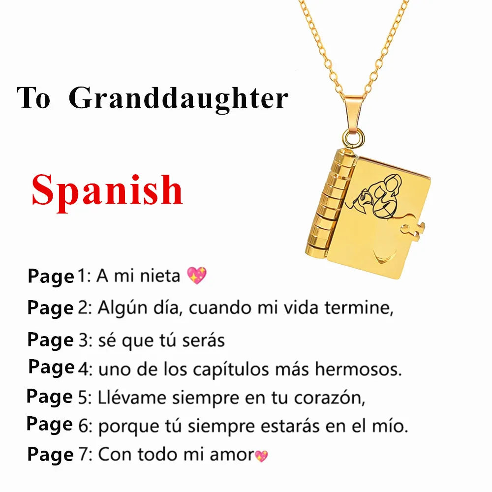 A gold pendant necklace shaped like an open book with a message for a granddaughter engraved on it.