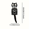 A black cartoon cat wall clock with a white bow and a swinging tail, showing the time.