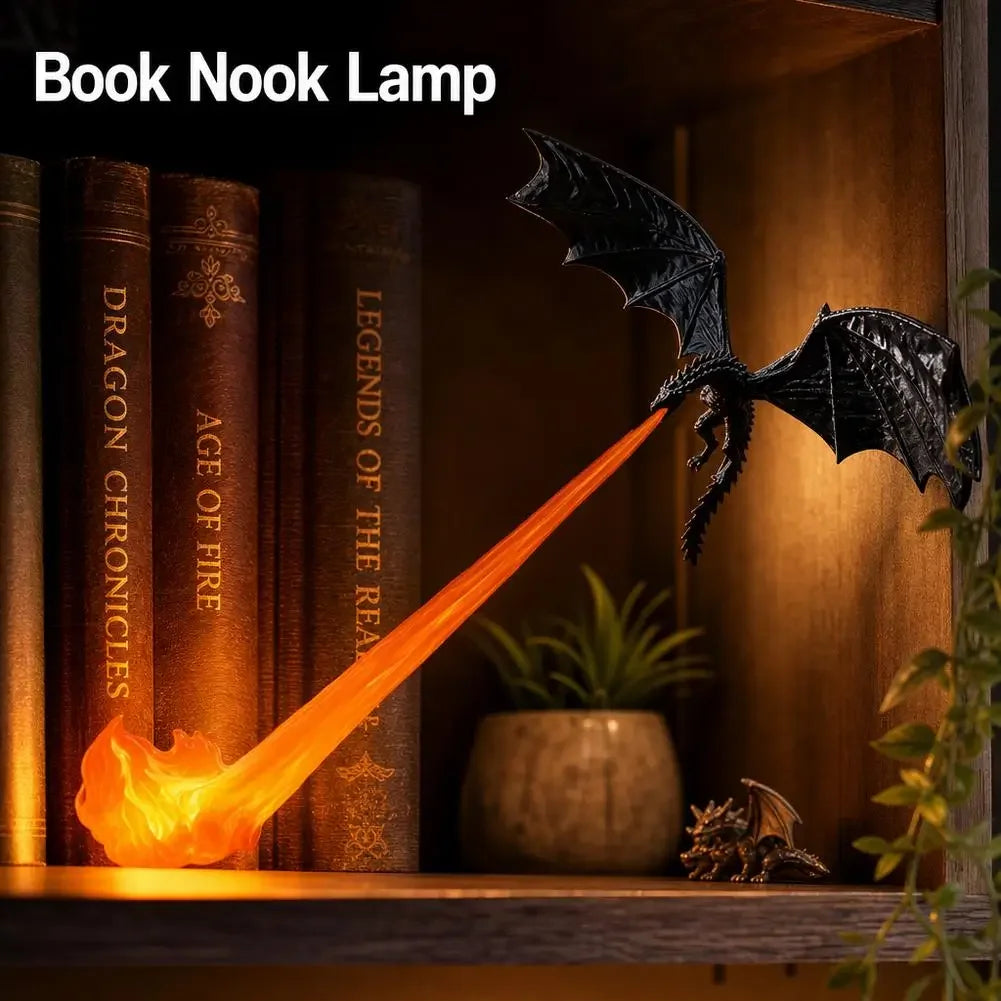 A book nook lamp featuring a dragon silhouette with glowing orange flame light illuminating books.