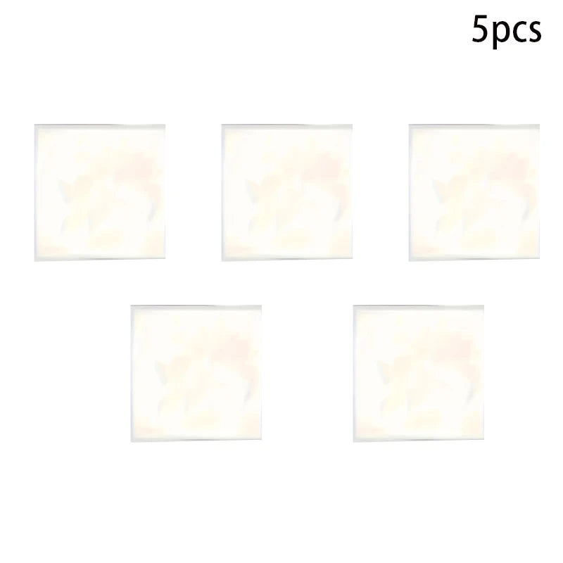 Five square acrylic photo ornaments with light pink and white marbled designs.