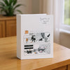 A white photo album with a cover featuring a cartoon illustration of a dog and text that reads Best Day!