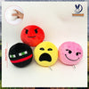 A collection of four plush dolls featuring various facial expressions and colors including red, yellow, pink, and black.