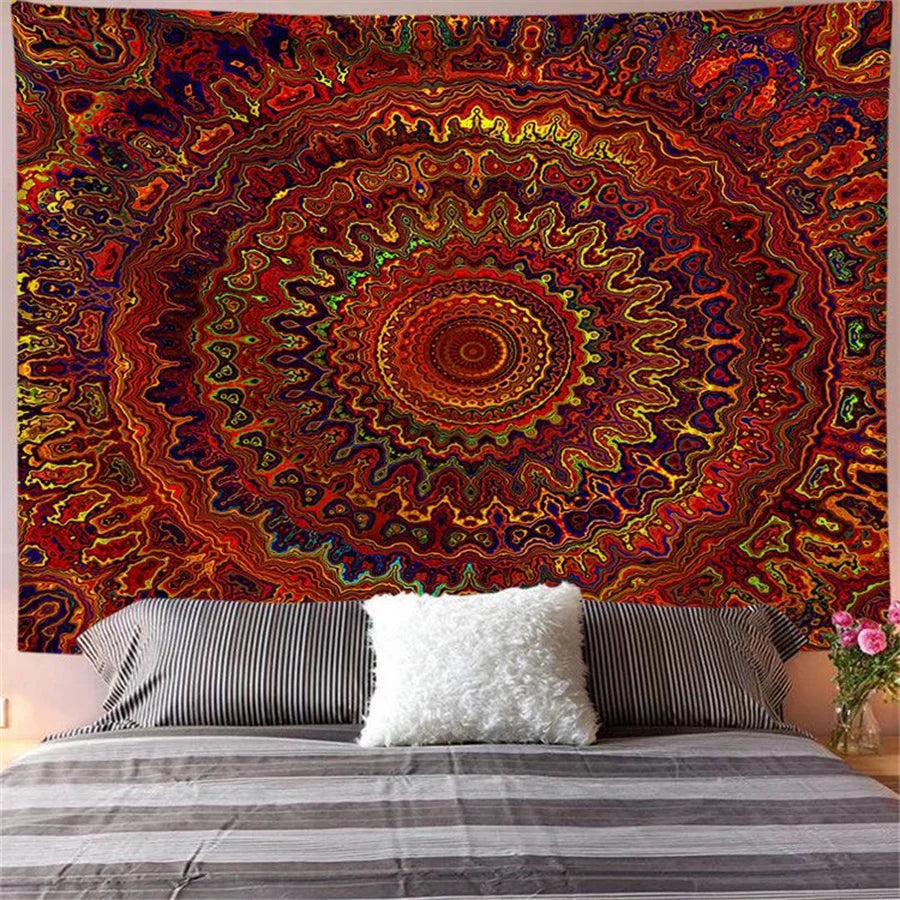 Bohemian mandala tapestry wall art featuring intricate, colorful, swirling patterns in shades of red, orange, and purple.