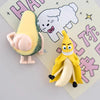 A set of cute 3D fruit fridge magnets featuring a yellow banana and a green avocado.