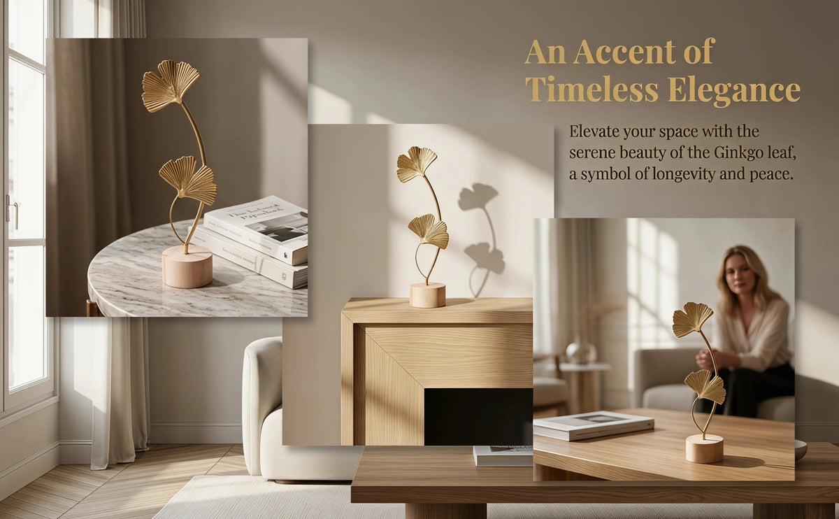 A set of golden Ginkgo leaf ornaments displayed on a wooden table in a modern interior setting.
